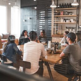 a social media team in a collaborative meeting outside the office
