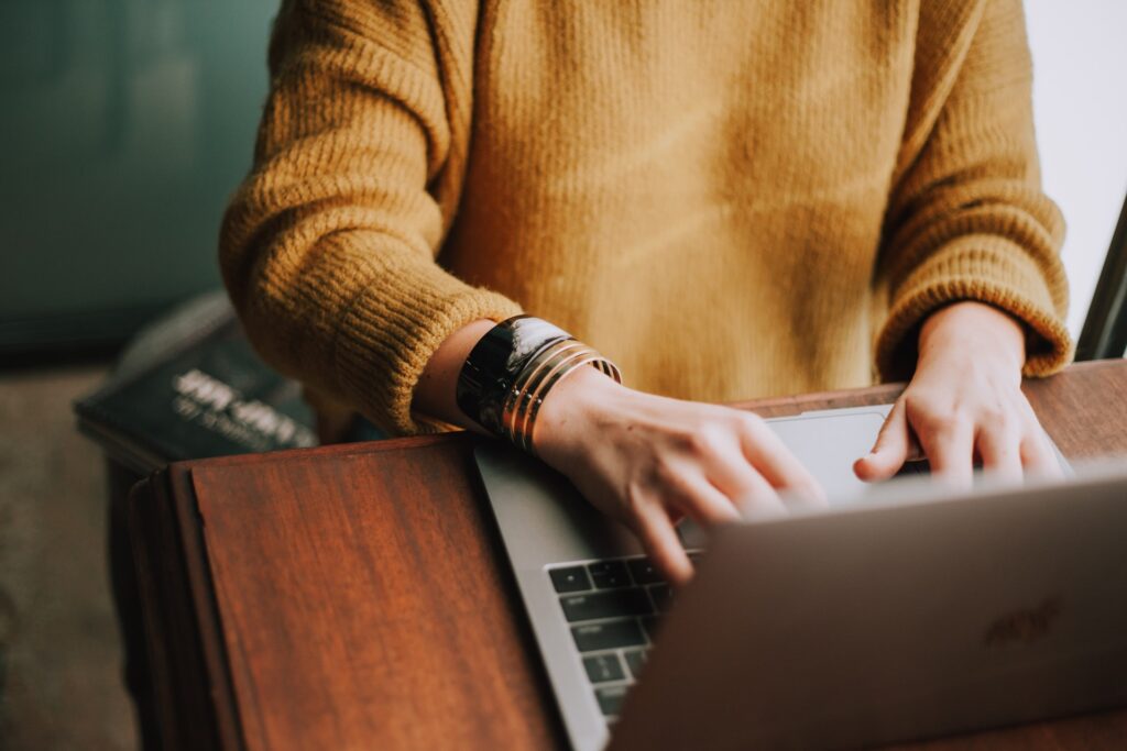 a social media marketing manager working on a laptop
