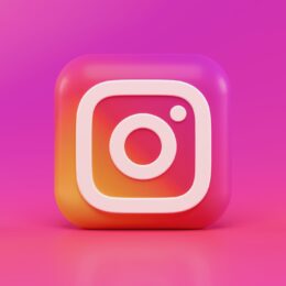 instagram logo in 3D form against a pink background